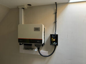 Solis 40 kW three-phase inverter and isolator on a plant-room wall at a care home in York