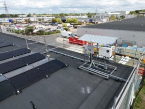Solis inverters on a roof-mounted frame beside the solar array, Peterborough